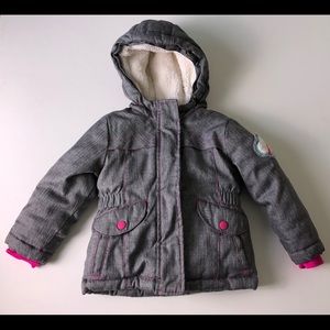 Water resistant winter jacket with hood.